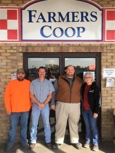 Farmer's Coop exterior with bulk feed team