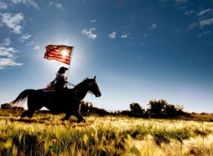 Farmers Coop Welcome Banner. Girl on horse with American flag.